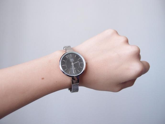 a person's hand with a watch on it